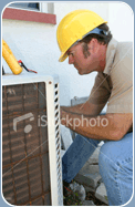 Technician repairing outside AC unit